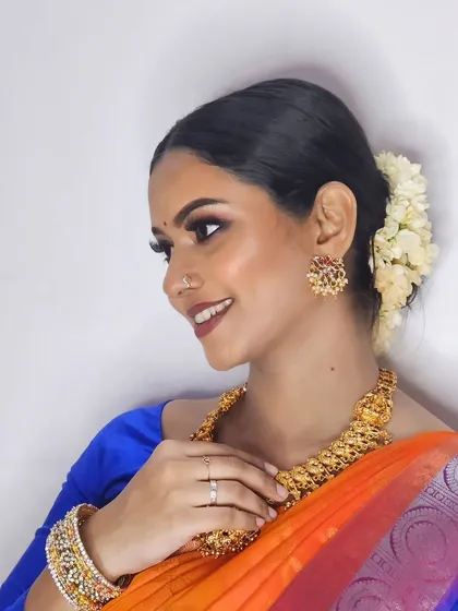 A smiling shot of my self-makeup look. It's always fun to get creative and try out new styles on myself.