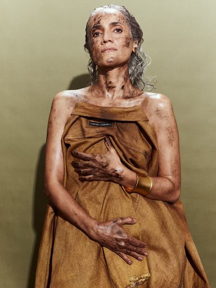 A beautiful and poignant portrait of a senior model from the Huemn cast, wrapped in a stained textile.