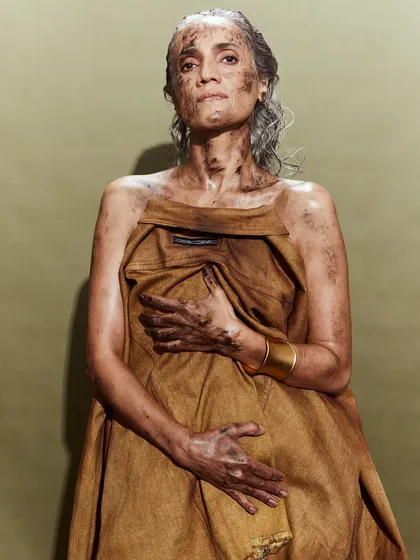 A poignant portrait of a model styled in a draped, deconstructed denim piece for the Huemn runway.