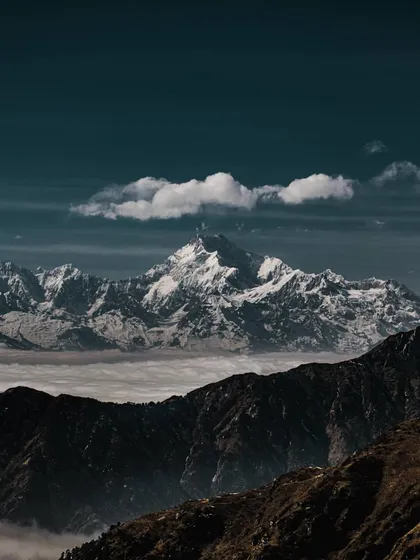 snow-capped mountains floating above a sea of clouds. the clean separation between elements here is a great reference for creating clear, organized layouts.