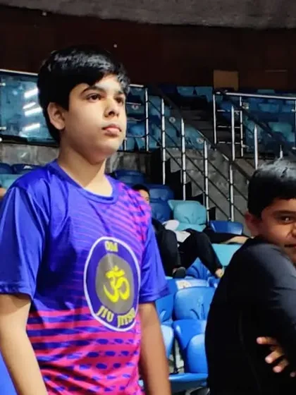 The calm before the storm. Our young competitors waiting for their matches at the international tournament. This experience builds focus and mental toughness.