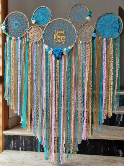 More than just decor, this "Good Vibes Only" dreamcatcher is a symbol of positivity and protection. The blend of blue, beige, and pink brings home some magic.