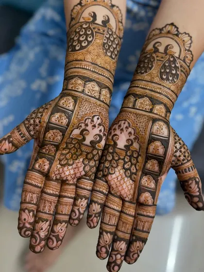This baby shower mehendi features elegant peacocks, a classic symbol of beauty and grace, to welcome the new arrival.