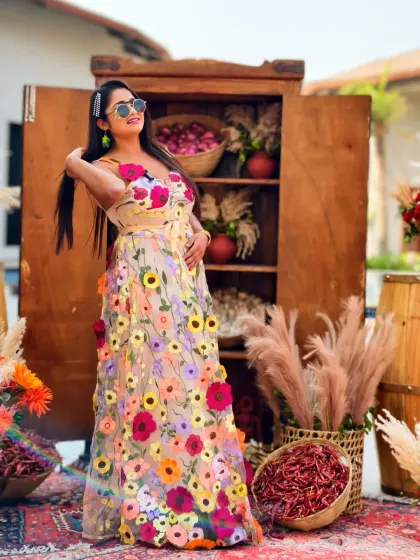 Posing with some of the unique decor elements at a Haldi carnival. The rustic charm combined with floral touches made for a visually stunning event.
