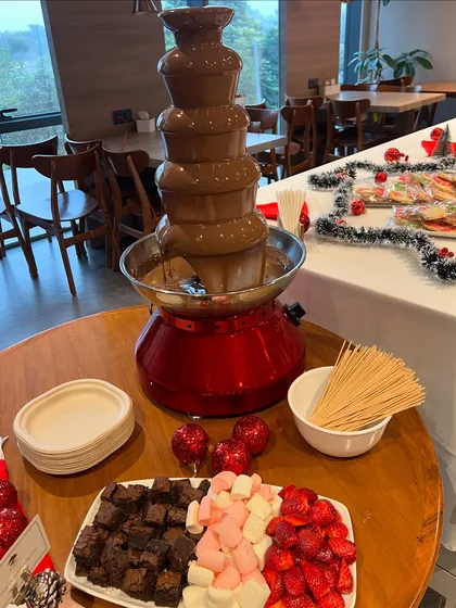 The highlight of the Christmas party was this chocolate fountain. We served it with fresh strawberries, marshmallows, and brownie bites for dipping, a fun and interactive dessert for everyone.