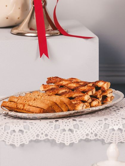 A plate of our assorted festive bakes, including crunchy biscotti and flaky palmiers, perfect for sharing during Diwali celebrations.