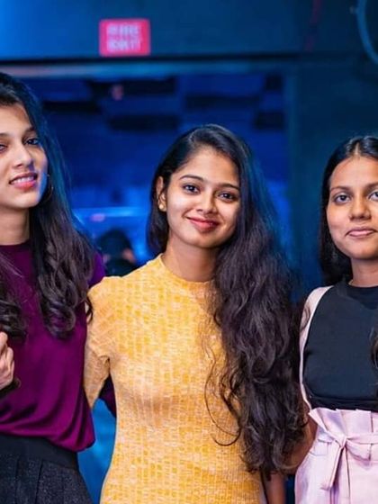 Friends posing for a photo during a fun night out. I provide the soundtrack for these memorable moments.