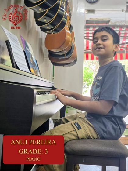 Anuj Pereira at the piano, focused on his sheet music for his Grade 3 exam. Our in studio lessons provide a professional environment for students to learn and grow.
