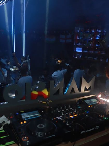 Another angle from my gig at Mansion, with the club's name visible on the console and the crowd dancing under the blue lights.