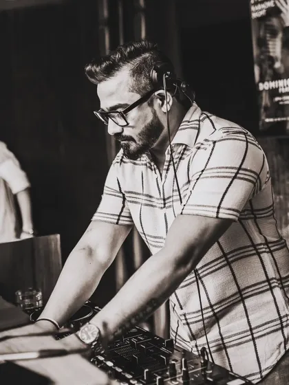 There's a certain magic to seeing things in black and white. It cuts through the noise and focuses on the soul of the music. Here I am, locked into the mix, finding the perfect beat for the moment.