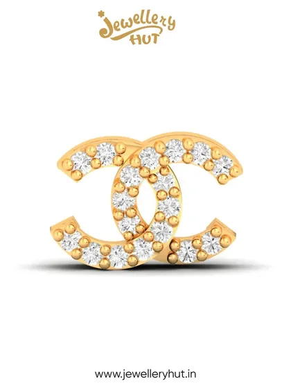 A close-up of our iconic logo-inspired stud, paved with sparkling stones. A single piece that embodies grace and timeless style.