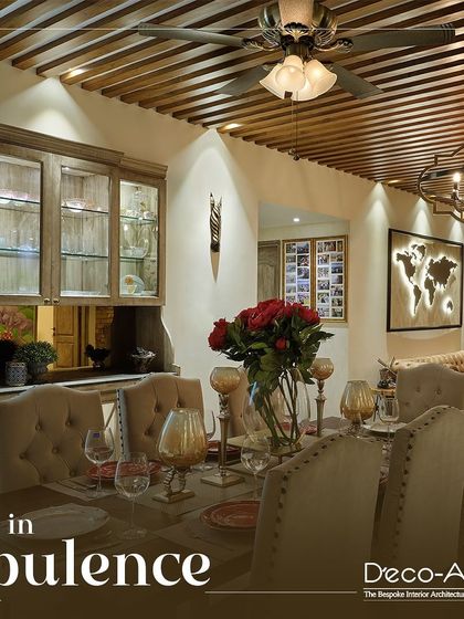 Transform every meal into an extraordinary experience with this elegantly designed dining space. The rich wood tones, tufted chairs, and rustic chandelier create an atmosphere of opulence and warmth.