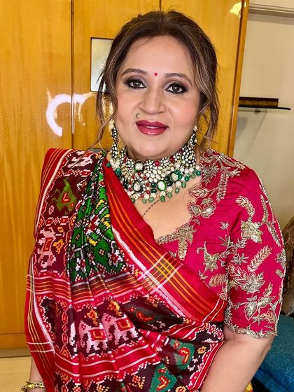 A happy and confident client ready for her event. The soft glam makeup enhances her natural beauty and makes her features pop.