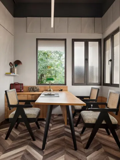 This meeting room at Aromasphere showcases our homage to a design classic. Our custom-made Chandigarh Chairs, crafted from oak and cane, sit around a simple wooden table, framed by large windows that look out onto lush greenery.