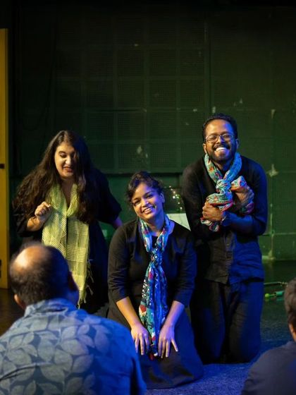 Actors in a Playback Theatre performance, responding to an audience member's story. This form of theatre requires deep listening and spontaneous creativity.