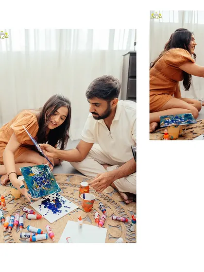 The couple working together on their canvas during a creative painting session in the studio.