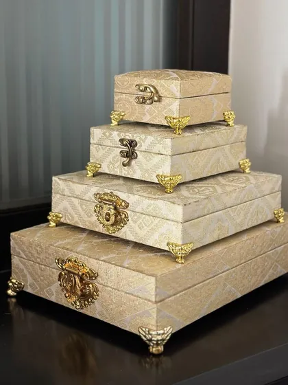 A different view of my stacking brocade boxes, showcasing their elegant design and ornate feet. These are a beautiful way to display and organize your trousseau items.
