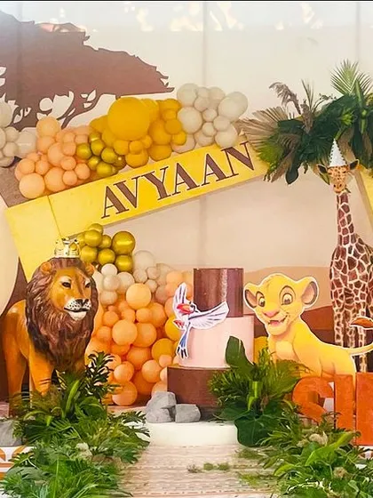 For this Lion King first birthday, I built a complete jungle safari scene. The setup includes life-sized character cutouts, themed balloon garlands, and lush greenery to transport guests to the Pride Lands.