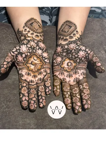 A full view of a Karwachauth design with a crescent moon motif, surrounded by a dense floral pattern.