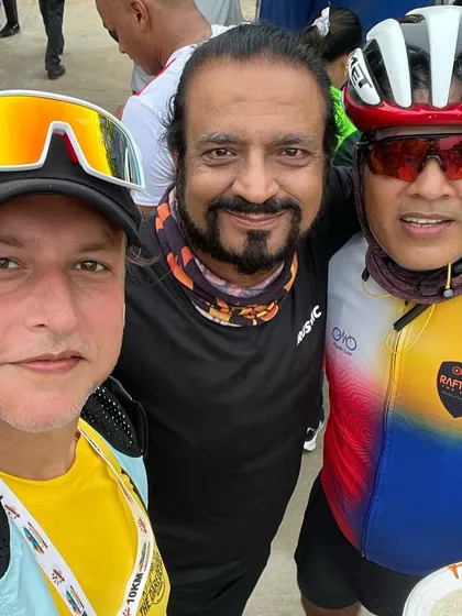 A group photo with runners and cyclists at an event. Our club represents both sports with pride.