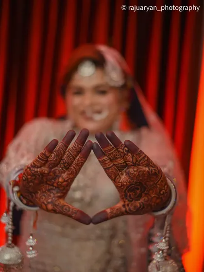 A detailed, artistic shot of the bride's beautiful henna design. Focusing on details like this preserves the memory of every element that made the day special.