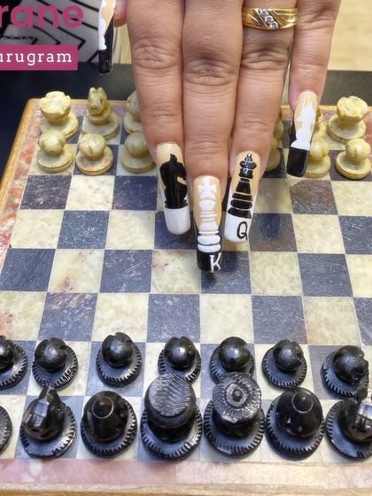 This image shows the nails interacting with a real chessboard, bringing the concept to life.