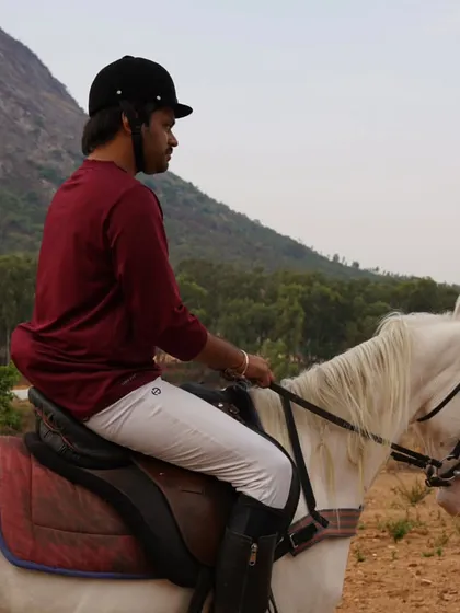Taking in the scenery from horseback. Our trail rides offer a peaceful escape and a chance to connect with nature.