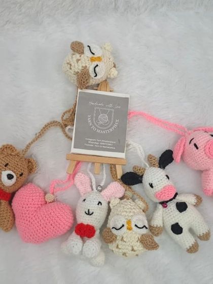 Another assortment of hanging toys for a baby gym, featuring a bear, pig, cow, bunny, owl, and more.