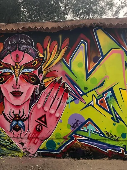 A full view of a collaborative mural, blending my figurative style with classic graffiti lettering. This piece shows how different artistic elements can come together on a single wall to create a complex, vibrant narrative.