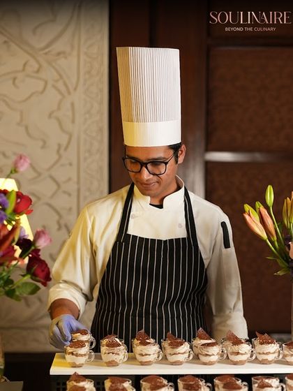 A chef carefully preparing tiramisu cups. The appreciation from our guests for our culinary creations and service inspires us to continue our work.