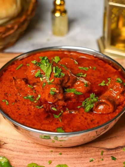 A hearty mutton curry, slow-cooked in a rich, red gravy. This dish is a centerpiece of our Ramadan catering menu, promising authentic and robust flavours.