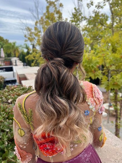 The full back view of the textured low ponytail, a perfect blend of casual and elegant.