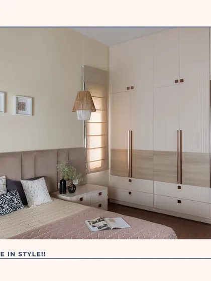 This bedroom showcases how to store in style. The floor-to-ceiling wardrobe features a mix of fluted and wood-grain finishes with rose gold handles, while the integrated mirror adds functionality and reflects light beautifully.