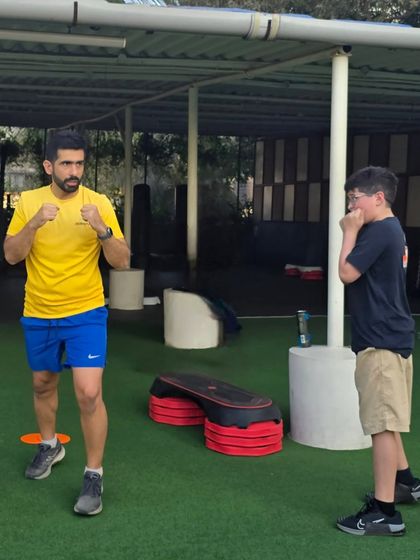 It all starts with the right stance. Our coach demonstrates the proper fighting stance, teaching the athlete how to maintain balance and be ready for both offensive and defensive moves.