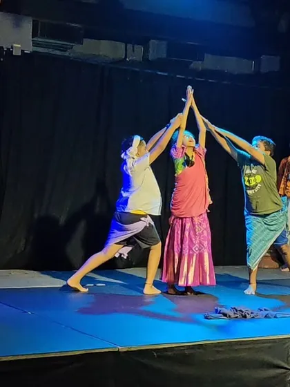 A group of young performers creating a beautiful formation on stage during their final showcase.