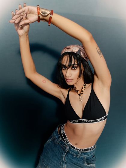 A dynamic and expressive pose that creates a sense of movement. This is perfect for a brand that wants to convey energy and confidence.