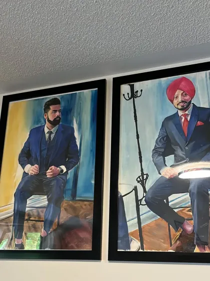 Two large, framed oil portraits of men in suits, created as a matching set. This is a powerful way to decorate a formal space or office.