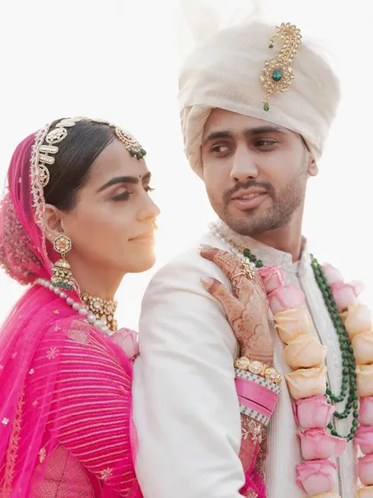A beautiful golden-hour portrait of the couple, the soft light creating a romantic and warm glow.