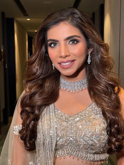 A close-up of the reception look, highlighting the flawless skin and the perfectly blended smoky eye. It's a look that's both chic and timeless.