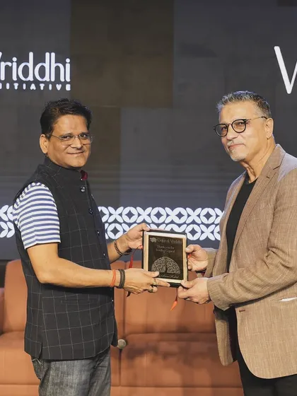 Presenting a token of appreciation at the Gujarat Vriddhi panel discussion. Collaboration between architects, developers, and policymakers is key to building better cities.