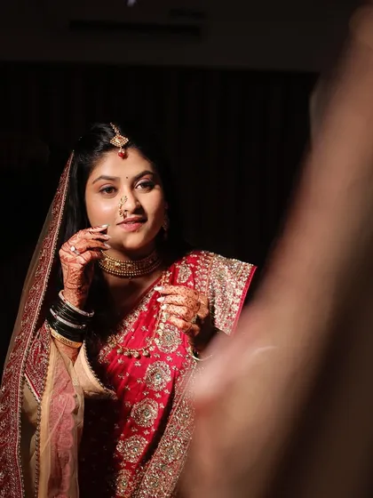 A moment of reflection in the mirror. The makeup is flawless, even in these artistic, moody shots.