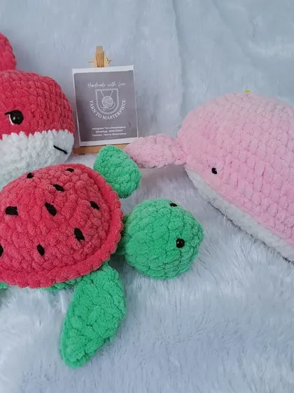 A collection of my plush sea animals, including a shark, a whale, and a watermelon turtle.