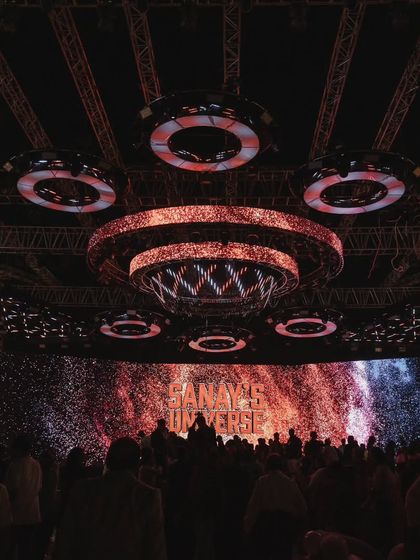 The main stage of 'Sanay's Universe' in all its glory. The massive LED screen and complex lighting truss create a concert-like experience for a truly grand celebration.