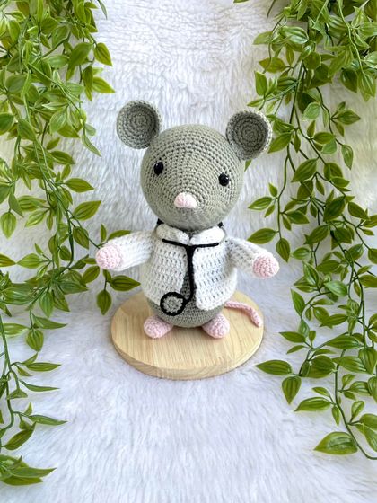 Dr. Mouse! This was a custom order for a graduation gift. The mouse is dressed in a doctor's apron with a tiny stethoscope and comes on a wooden base to be a display piece.