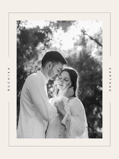 A classic black and white portrait of a couple, framed with their names, exuding timeless elegance.