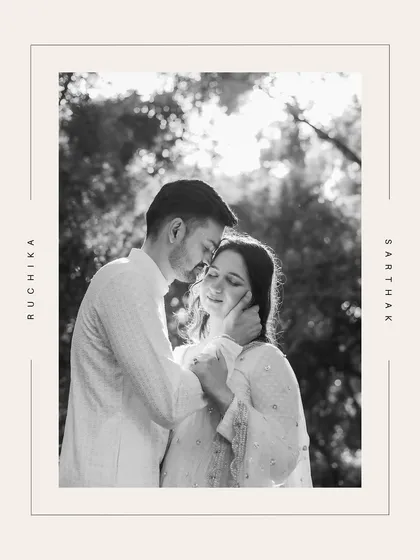 A classic black and white portrait of a couple, framed with their names, exuding timeless elegance.