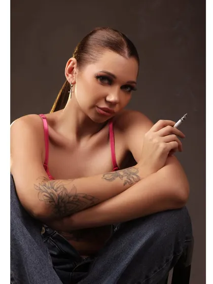 A relaxed and confident pose from the same edgy series, with the model looking directly at the camera.