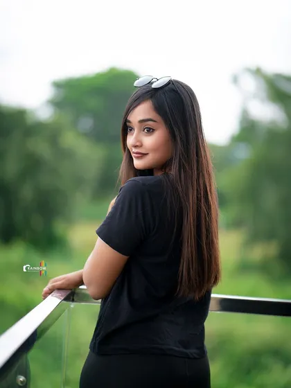 A simple, candid-style portrait in a black t-shirt against a natural backdrop. This shows my ability to capture authentic moments and personality.
