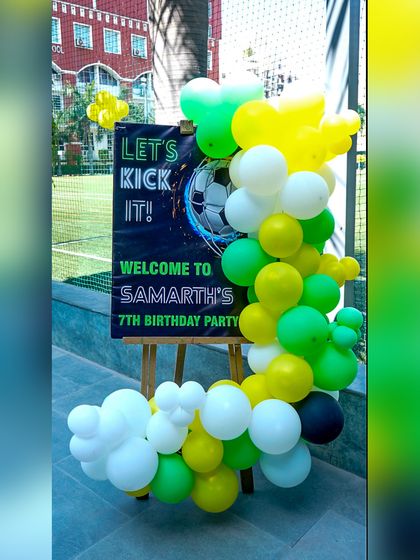 The welcome sign for Samarth's football party, inviting guests to "kick it" and have a great time.