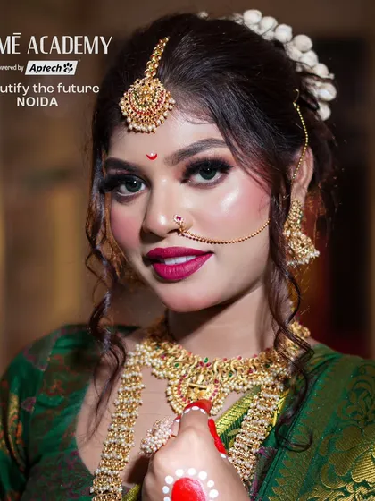 A close-up of a traditional Bengali bridal look. We teach the iconic elements, including the bold red bindi, white mukut, and intricate chandan designs on the forehead.